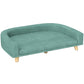 Green pet sofa bed with rounded arms, padded cushion, and wooden legs