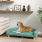 Green pet sofa bed with cushioned seat and wooden legs, suited for large pets