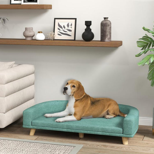 Green pet sofa bed with cushioned seat and wooden legs, suited for large pets