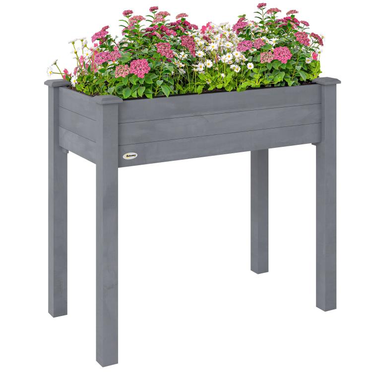 Raised dark gray wooden planter box with four legs, filled with flowers and herbs