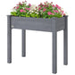 Elevated dark gray wooden planter box with open sides and planted flowers