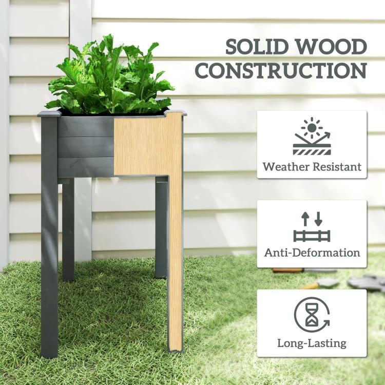 Elevated dark gray wooden planter box with solid wood-style legs and planted greens