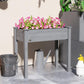Dark gray raised wooden planter box with flowers, front opening and four legs