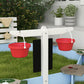 Blue wooden sandbox frame with black side panels and white corner posts