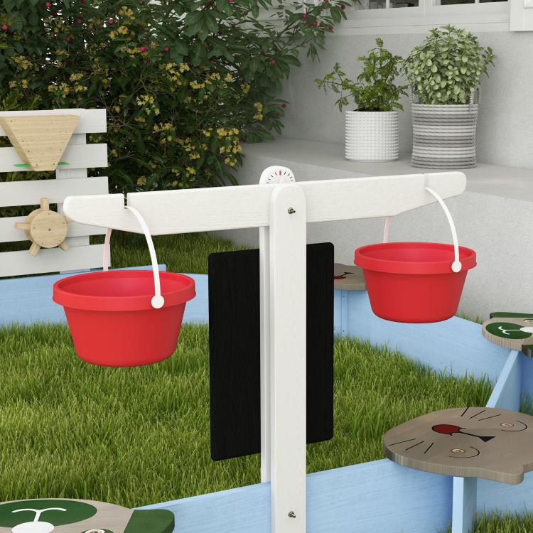 Blue wooden sandbox frame with black side panels and white corner posts