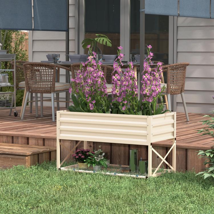 Cream metal raised garden bed with legs and lower shelf, planted with tall purple flowers
