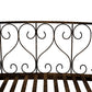 Close-up of bronze metal scrollwork side railing panel with heart motif