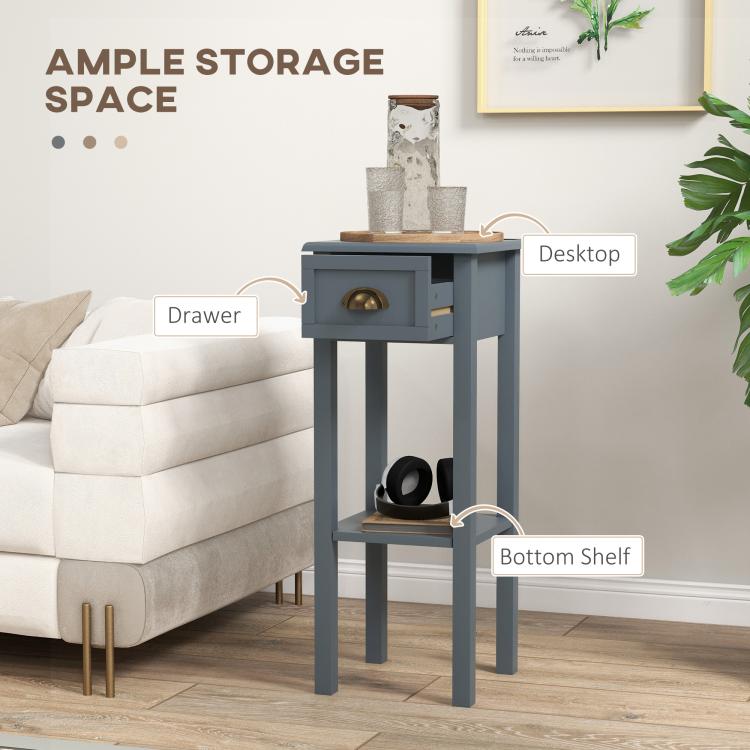 Gray side table with drawer and lower shelf, with an open cubby for storage.