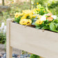 Raised wooden garden planter box with open grid compartments along the front