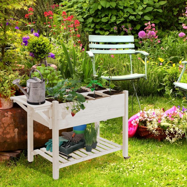 White wooden raised planter bed with open storage shelf and wheeled stand