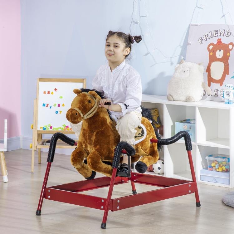 Kids plush rocking horse with red metal base, ridden by a child in white outfit