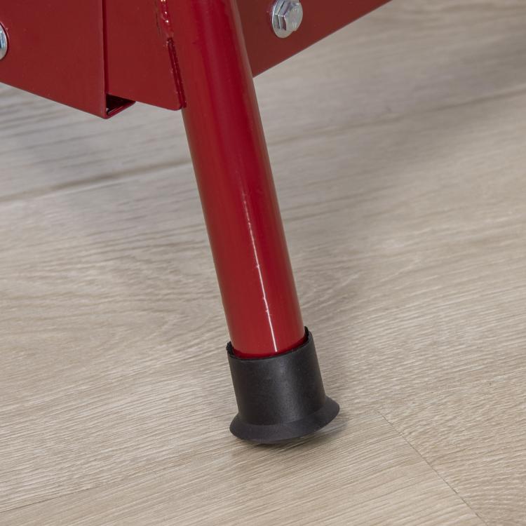 Red rocking horse support leg with black rubber foot on tile floor