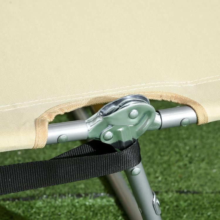 Beige tanning chair with face cutout, adjustable strap, and metal frame clamp detail