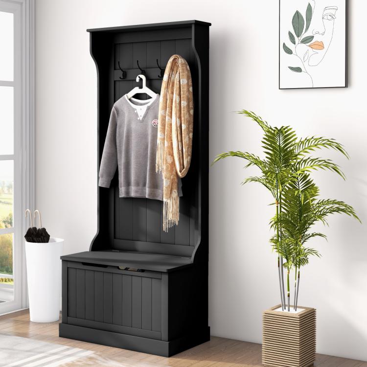 Black entryway hall tree with coat hooks and sitting bench, hanging coats and scarf