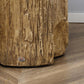 Bark-textured concrete stump side table with cylindrical base and round top (close-up)