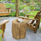 Tree stump end table with round top and bark-textured finish, used as patio side table