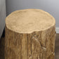 Close-up of tree stump end table top and side with rough concrete-like texture, brown