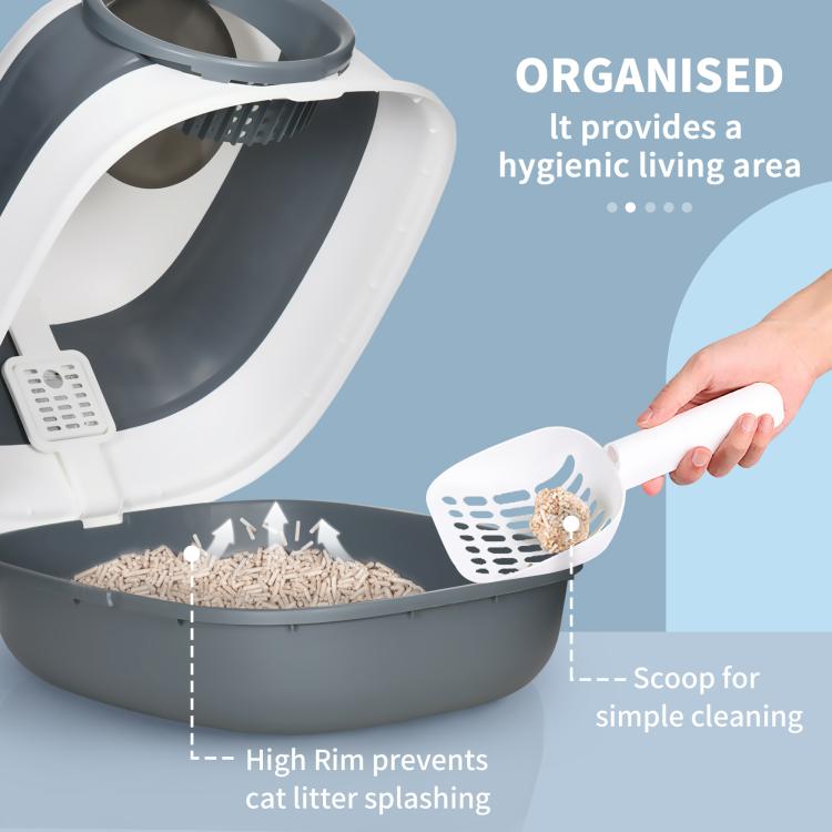 Cat litter box interior with high rim, white scoop and gray base
