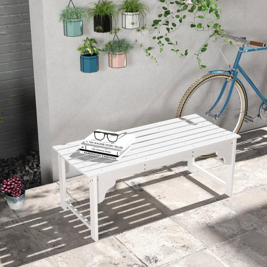 White slatted wooden garden bench with curved seat front, styled outdoors with decor