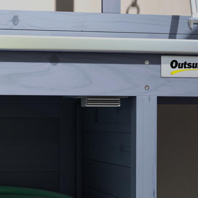 Gray wooden potting bench with storage cabinet, open interior, and metal tabletop