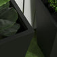 Close-up of black stackable outdoor planter sides with smooth finish