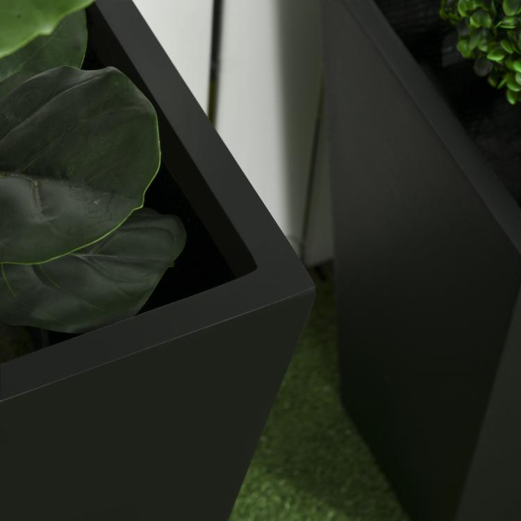 Close-up of black stackable outdoor planter sides with smooth finish