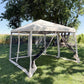 Beige pop-up canopy tent with enclosed dark netting sides and front zip door