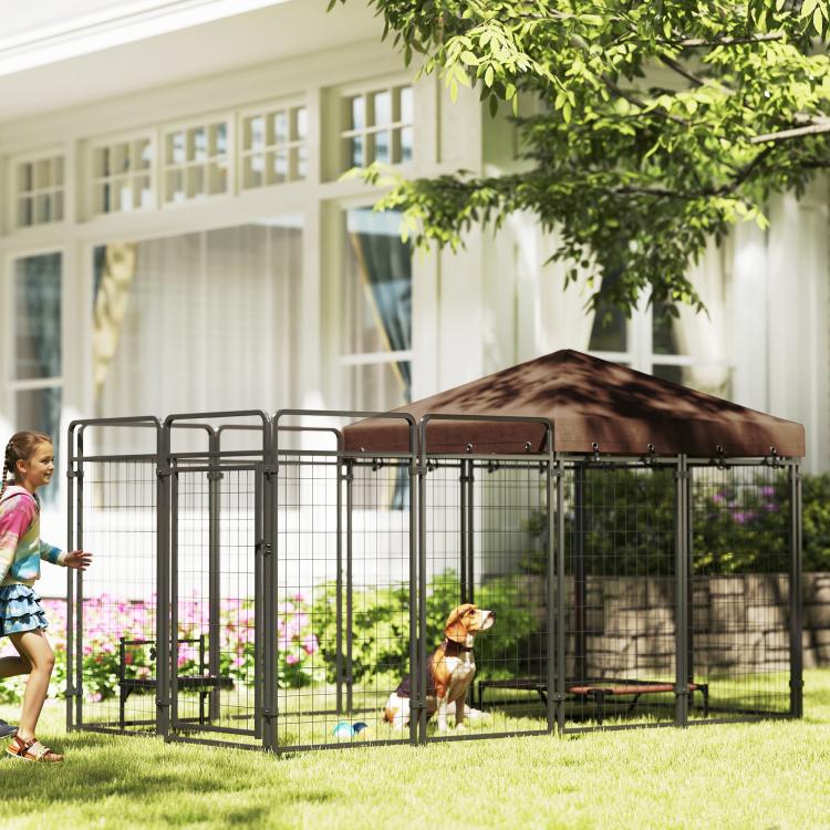 Outdoor dog kennel with steel wire mesh and brown canopy roof, front view in yard