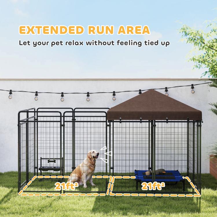 Outdoor dog kennel run with brown canopy and steel mesh sides, with hanging rope lights