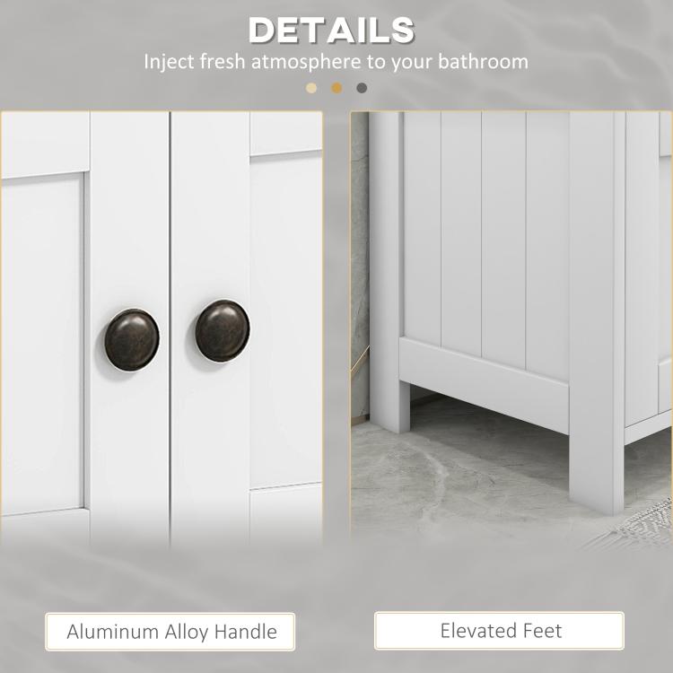 White cabinet door detail with round knobs and vertical panel molding