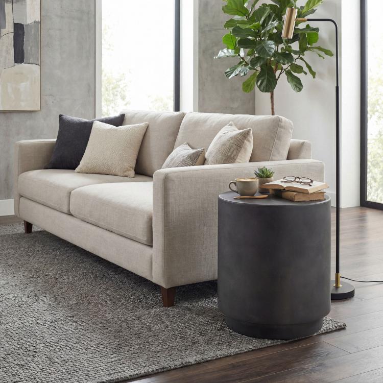 Dark gray round concrete-finish side table with cylindrical top