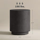 Dark gray round side table with concrete-look finish, shown with size dimensions