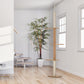 Light brown cat tree with sisal posts and three visible wooden platforms in a room