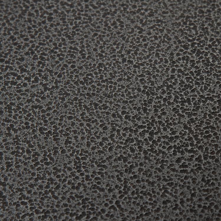 Stainless steel surface with speckled texture