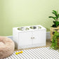 White raised dog feeding stand with two stainless steel bowls and double cabinet doors