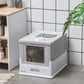 Gray and white enclosed cat litter box with front window opening in a corner setup