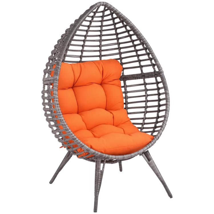 Rattan egg chair with orange padded seat cushion and curved wire basket frame