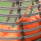 Egg chair cushion attachment detail with orange tie straps on dark wicker rungs