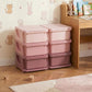 Pink 3-tier storage organizer with six closed drawer bins in a kids room