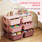 Pink 3-tier storage organizer with six drawer bins open for toys and books
