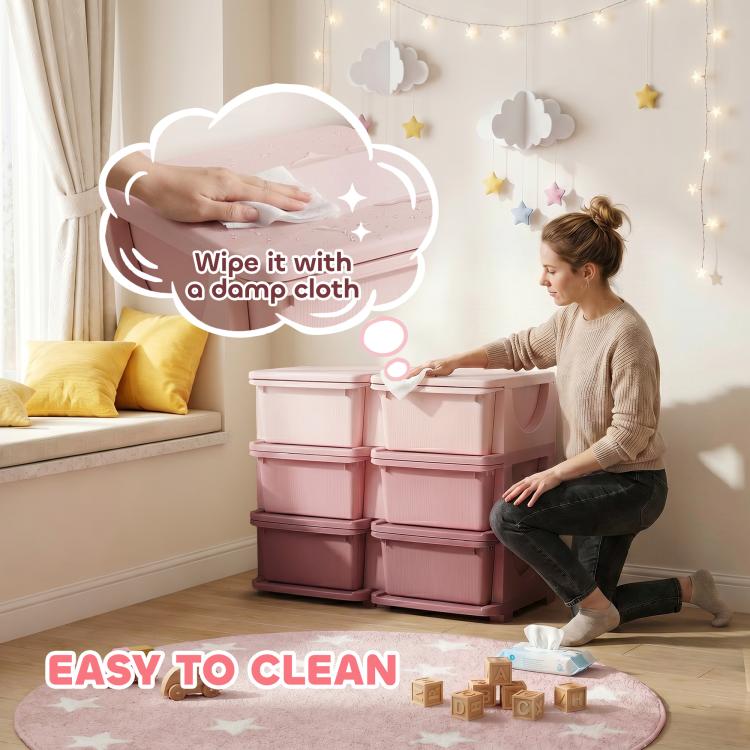 Pink 3-tier storage organizer being wiped clean with a damp cloth