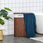 Brown bamboo laundry hamper with lid and string handle, blue fabric draped over top
