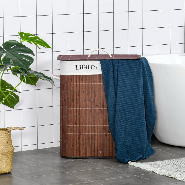 Brown bamboo laundry hamper with lid and string handle, blue fabric draped over top