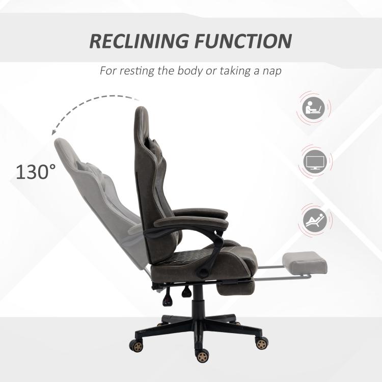 Dark brown gaming chair reclined with extended footrest and padded armrests