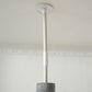 Adjustable cat tree top with white ceiling-mounted pole and grey scratching base