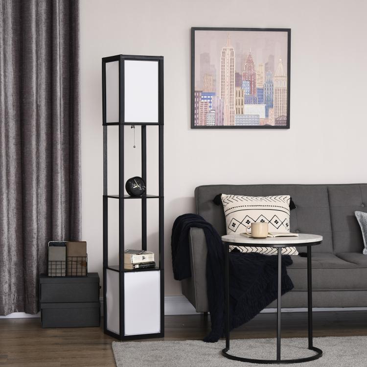 Black tall shelf floor lamp with illuminated panels and open shelves in a living room