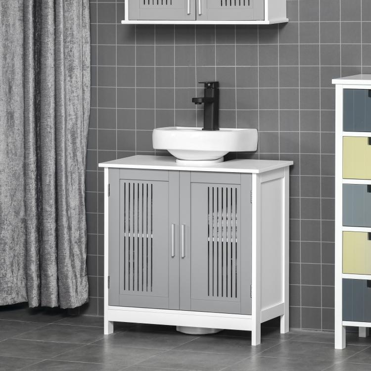 White bathroom vanity with grey slatted doors and countertop sink