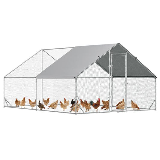 Outdoor chicken coop with gray roof, white wire mesh walls, and front door panel