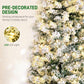 Close-up of snow-flocked artificial Christmas tree branches with warm pre-lit LED lights