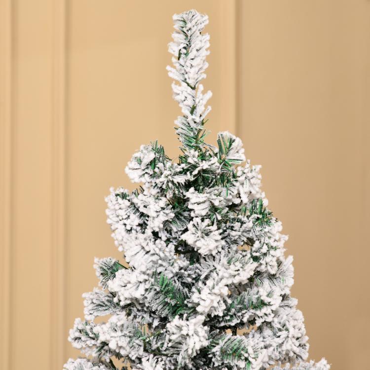 Snow-flocked slim artificial Christmas tree with dense branches and warm pre-lit LEDs
